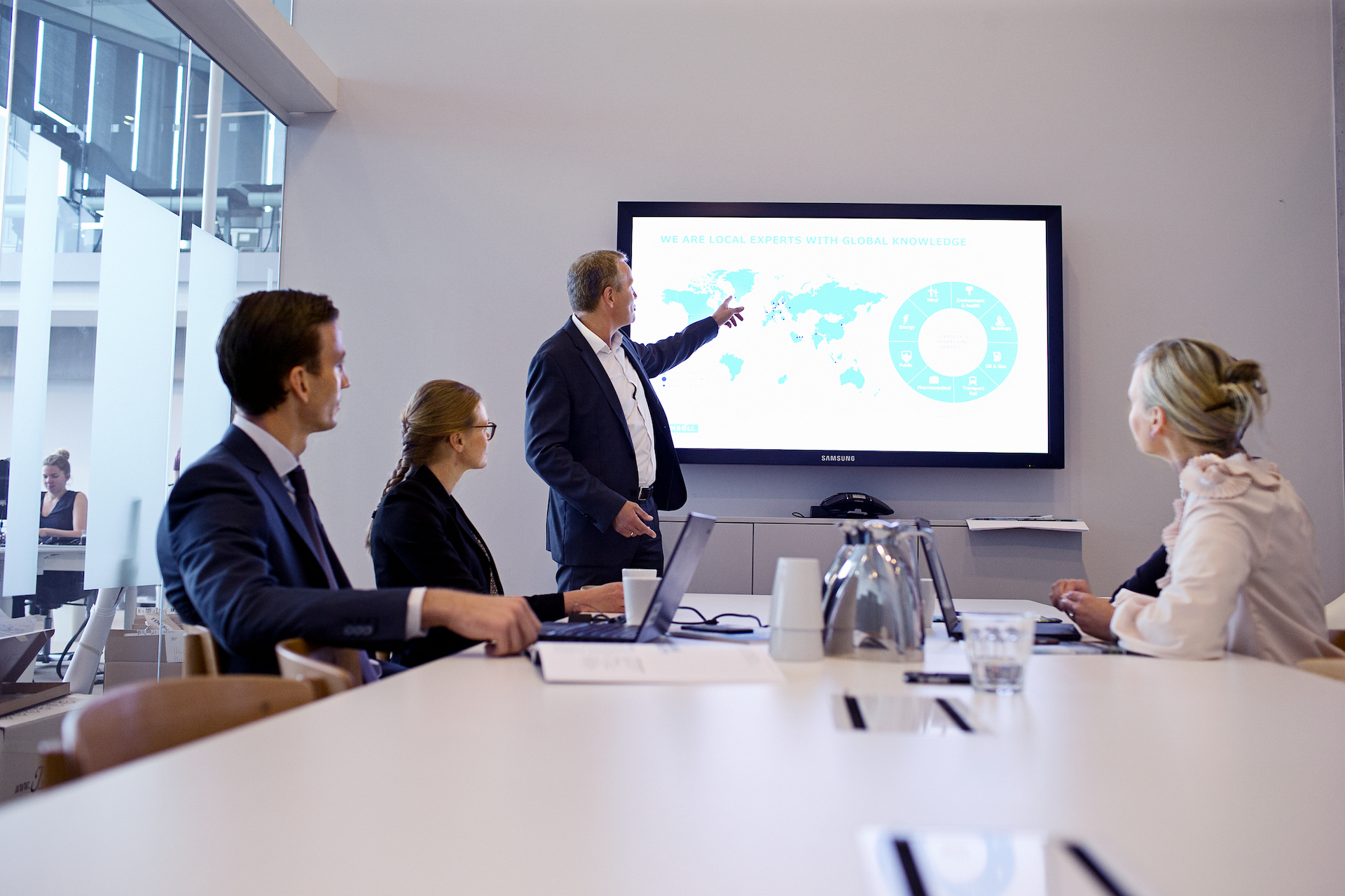 Ramboll employees in a meeting with a presenter