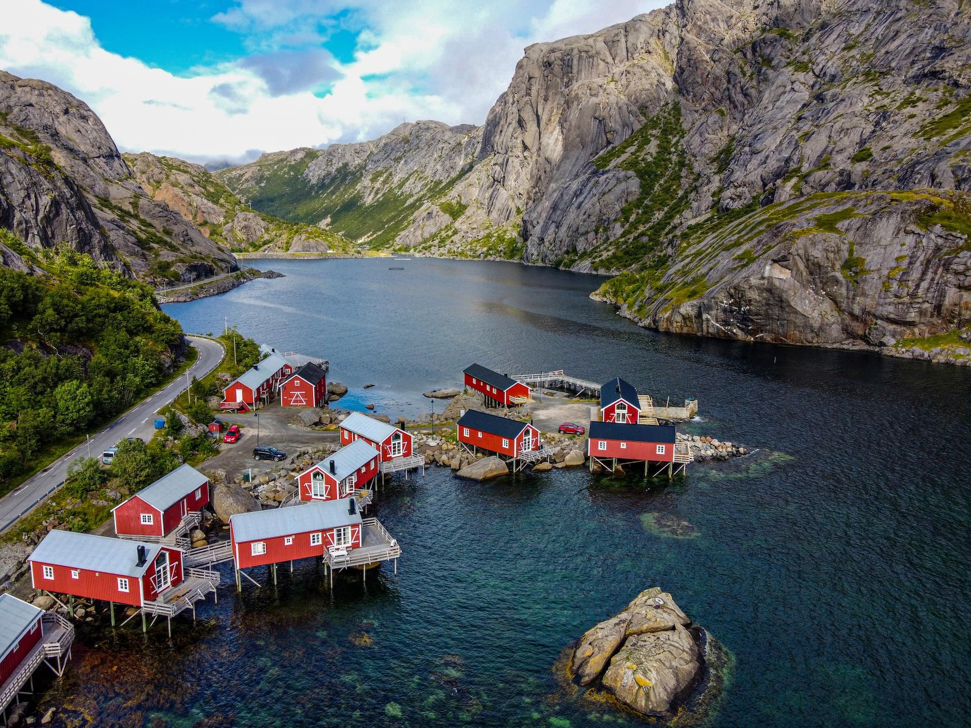 Norway, Nordland, Nusfjord, Aerial view of fishing village lying along Vestfjorden