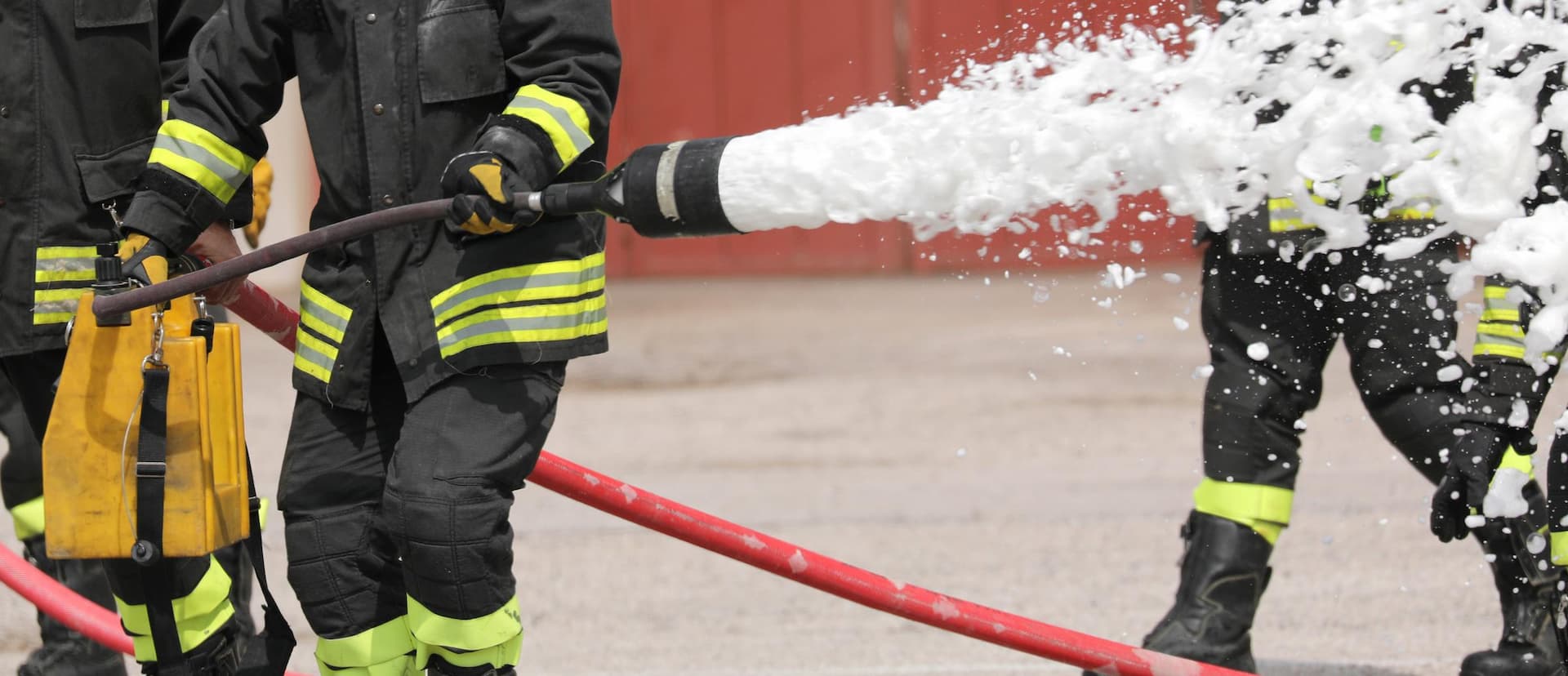 firefighter uses a powerful foaming agent to put out a fire; Shutterstock ID 1787172524; purchase_order: Violeta Mangovski