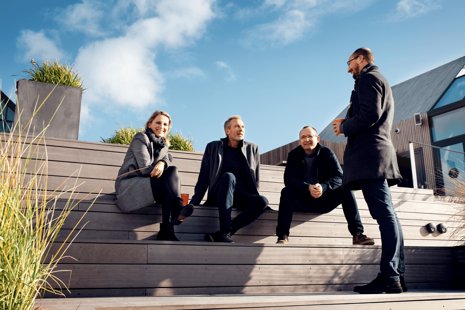 People sitting on a terrace on Salling Rooftop in Aarhus Denmark.