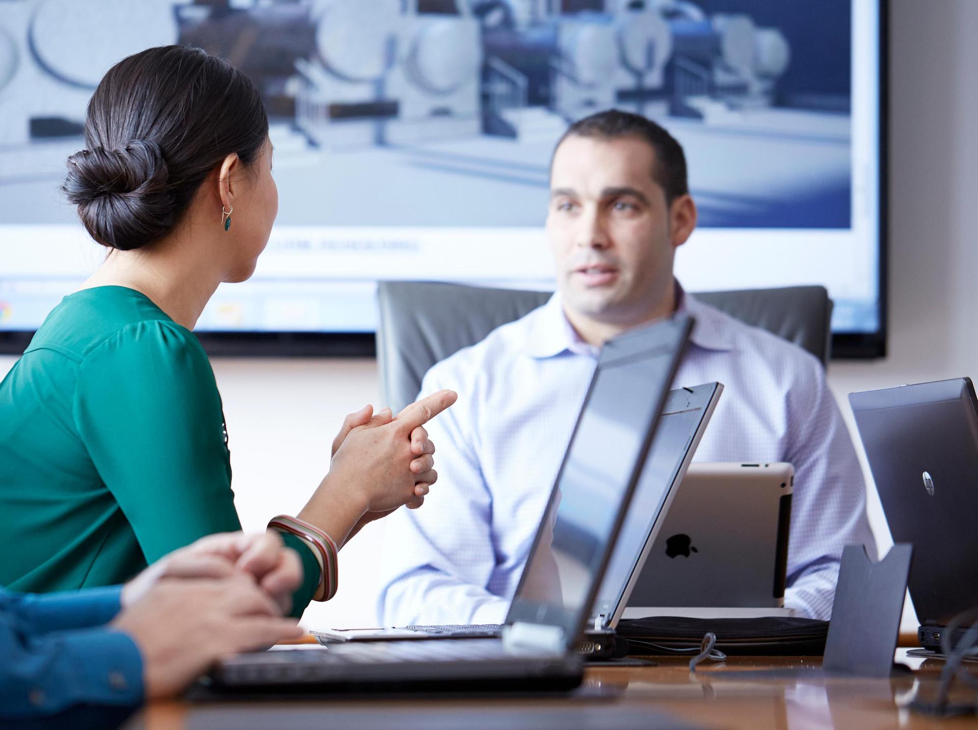 Man discussing process in conference room setting