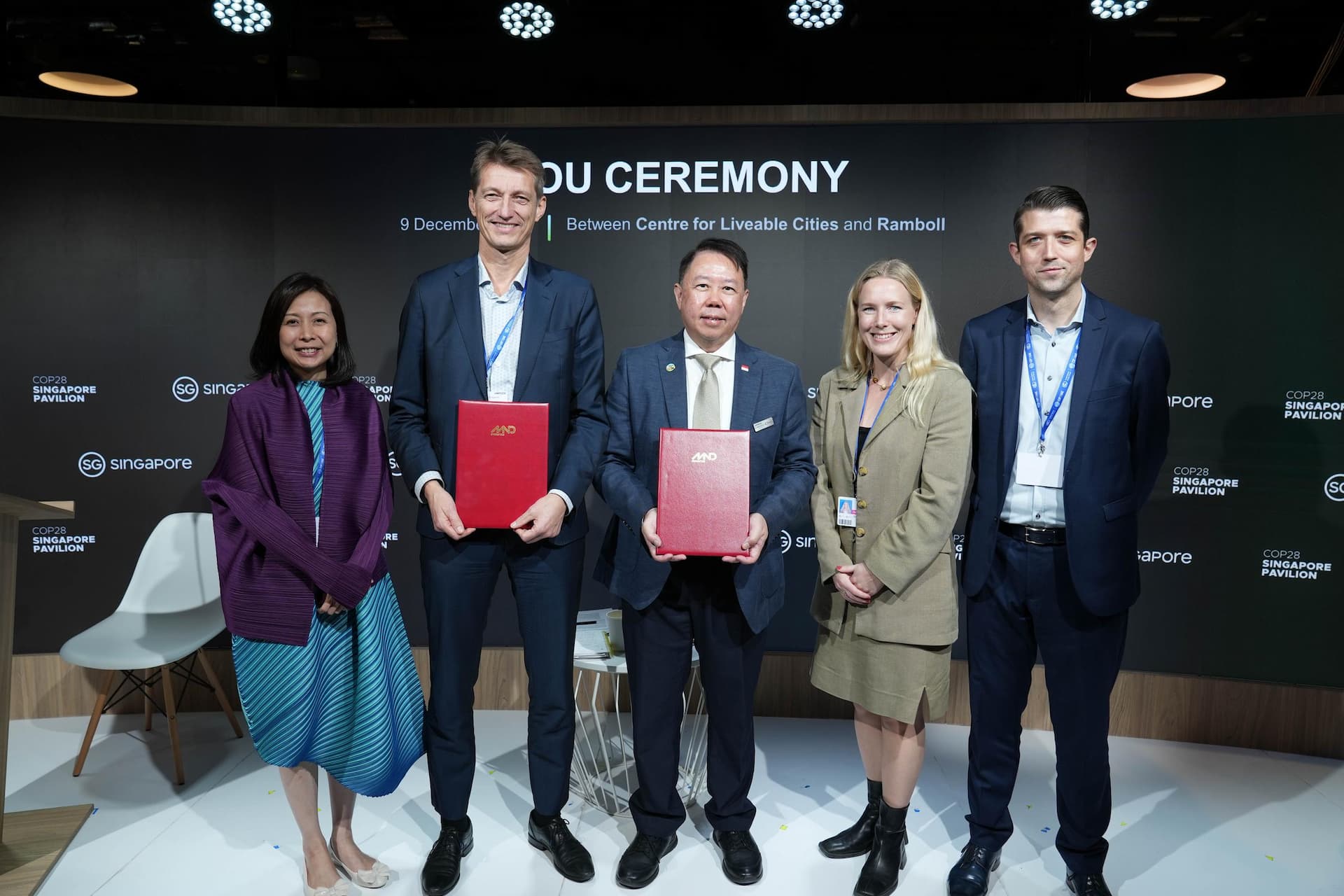 Ramboll and Centre for Liveable Cities seal the MoU at the COP28 Singapore Pavillion.