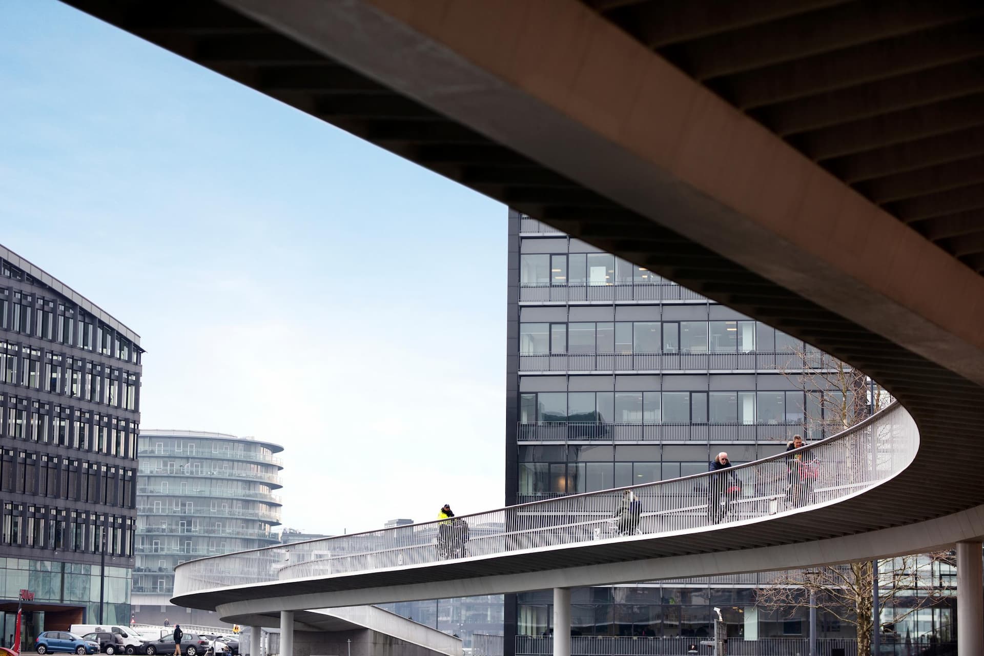 People biking on Cykelslangen, bike bridge across the harbour in Copenhagen